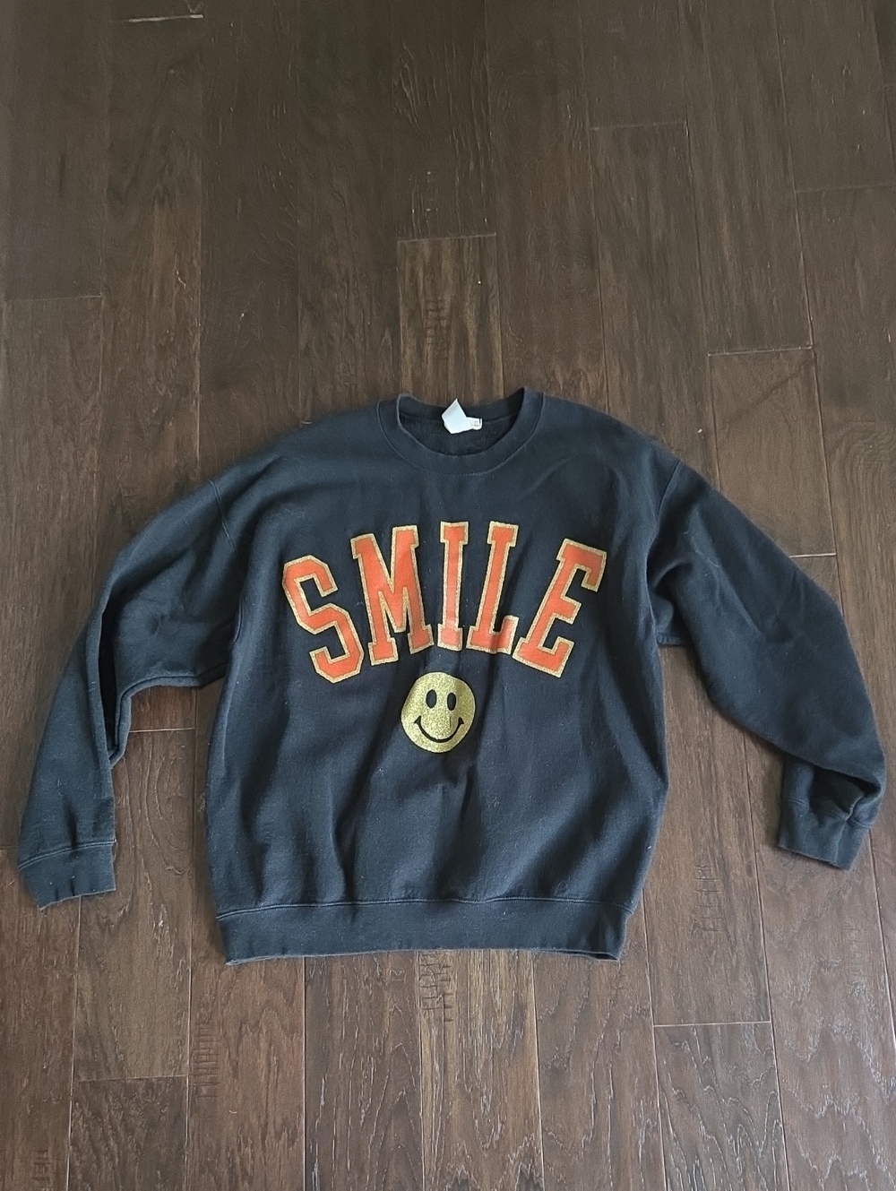 Black 'SMILE' Graphic Sweatshirt with Orange & Gold Lettering - Altar'd State